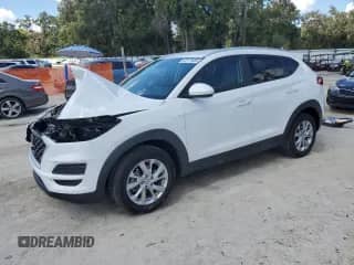 2021 Hyundai Tucson Value with VIN KM8J33A40MU311842, listed as a Copart auction lot 82171885 with 59,277 mi miles and Salvage title. Bid and sale history available at DreamBid. Image 1.