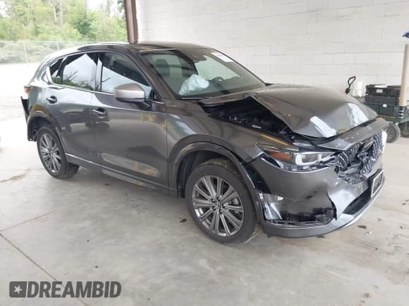 ✅ 2024 Mazda CX-5 Signature • VIN: JM3KFBXYXR0387692 • Lot: 42610108. Listed on IAAI with 15,464 mi. Free auction sales archive from the USA and detailed vehicle history report at DreamBid. Image 1.