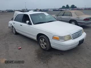✅ 2003 Ford Crown Victoria Standard • VIN: 2FAFP73W83X166521 • Lot: 42428470. Listed on IAAI with 219,012 mi. Free auction sales archive from the USA and detailed vehicle history report at DreamBid. Image 1.