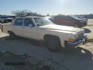 ✅ 1988 Cadillac Brougham • VIN: 1G6DW51Y9J9710161 • Лот: 87093424. Опубликован ранее на Copart с пробегом 59 519 миль. Бесплатный доступ к архиву аукционных продаж из США и подробный отчёт об истории автомобиля на DreamBid. Изображение 4.