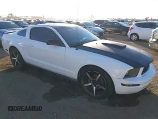 ✅ 2007 Ford Mustang Deluxe • VIN: 1ZVHT80N475210616 • Lot: 43895736. Listed on IAAI with 205,099 mi. Free auction sales archive from the USA and detailed vehicle history report at DreamBid. Image 1.