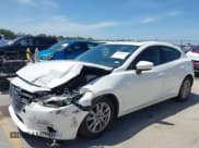 ✅ 2014 Mazda 3 i Touring • VIN: JM1BM1L77E1161507 • Lot: 42857954. Listed on IAAI with 102,273 mi. Free auction sales archive from the USA and detailed vehicle history report at DreamBid. Image 2.