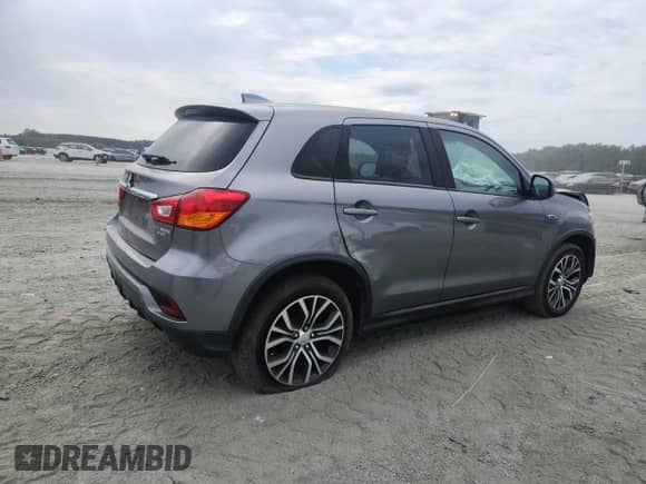 2018 Mitsubishi Outlander ES with VIN JA4AP3AU8JU011321, listed as a Copart auction lot 71012085 with 132,321 mi miles and Salvage title. Bid and sale history available at DreamBid. Image 3.