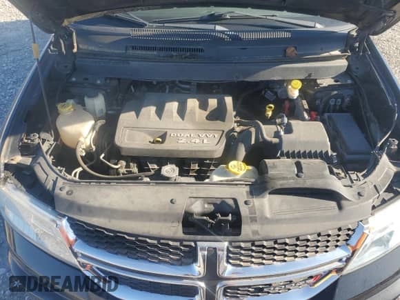 2013 Dodge Journey American Value with VIN 3C4PDCAB5DT597224, listed as a Copart auction lot 82536665 with 104,666 mi miles and Clean title. Bid and sale history available at DreamBid. Image 12.