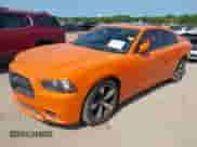 2014 Dodge Charger SXT with VIN 2C3CDXHG6EH295785, listed as a IAAI auction lot 42412463 with 117,271 mi miles and . Bid and sale history available at DreamBid. Image 2.