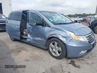 ✅ 2012 Honda Odyssey Touring • VIN: 5FNRL5H90CB126640 • Lot: 43287795. Listed on IAAI with 185,534 mi. Free auction sales archive from the USA and detailed vehicle history report at DreamBid. Image 1.