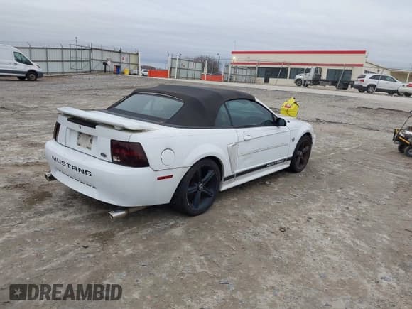 ✅ 2004 Ford Mustang Deluxe • VIN: 1FAFP44694F208401 • Lot: 43871483. Listed on IAAI with 133,344 mi. Free auction sales archive from the USA and detailed vehicle history report at DreamBid. Image 4.