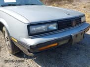 ✅ 1987 Oldsmobile Calais • VIN: 1G3NF14L6HM279358 • Lot: 42526934. Listed on IAAI with 115,666 mi. Free auction sales archive from the USA and detailed vehicle history report at DreamBid. Image 12.