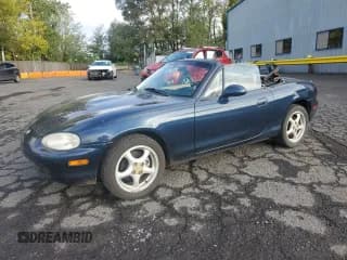 ✅ 1999 Mazda MX-5 Miata • VIN: JM1NB3530X0118323 • Lot: 82630585. Listed on Copart with 114,883 mi. Free auction sales archive from the USA and detailed vehicle history report at DreamBid. Image 1.