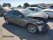 ✅ 2016 Ford Fusion Titanium Hybrid • VIN: 3FA6P0RU4GR125580 • Лот: 70785425. Опубликован ранее на Copart с пробегом 105 472 миль. Бесплатный доступ к архиву аукционных продаж из США и подробный отчёт об истории автомобиля на DreamBid. Изображение 4.