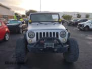 ✅ 2012 Jeep Wrangler Unlimited Sport • VIN: 1C4BJWDG8CL143023 • Lot: 43447646. Listed on IAAI with 119,924 mi. Free auction sales archive from the USA and detailed vehicle history report at DreamBid. Image 12.