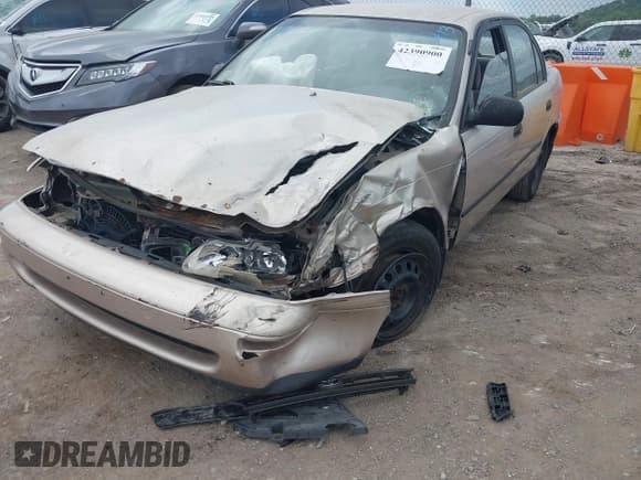 ✅ 1995 Toyota Corolla DX • VIN: 1NXAE09B7SZ337590 • Lot: 42390900. Listed on IAAI with 133,495 mi. Free auction sales archive from the USA and detailed vehicle history report at DreamBid. Image 2.