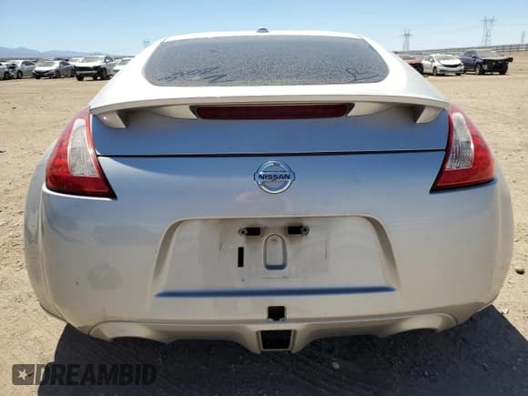 ✅ 2014 Nissan 370Z • VIN: JN1AZ4EHXEM636041 • Лот: 60835255. Опубликован ранее на Copart с пробегом 69 676 миль. Бесплатный доступ к архиву аукционных продаж из США и подробный отчёт об истории автомобиля на DreamBid. Изображение 6.