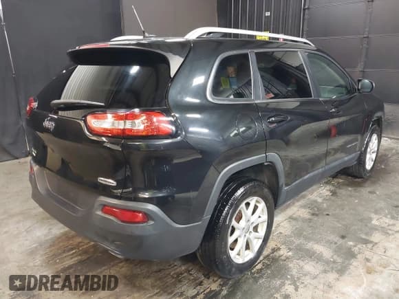 ✅ 2014 Jeep Cherokee Altitude • VIN: 1C4PJMCS0EW220176 • Lot: 42162678. Listed on IAAI with 127,370 mi. Free auction sales archive from the USA and detailed vehicle history report at DreamBid. Image 4.