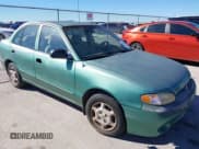 ✅ 1998 Hyundai Accent GL • VIN: KMHVF24NXWU506566 • Лот: 43575139. Опубликован ранее на IAAI с пробегом 144 846 миль. Бесплатный доступ к архиву аукционных продаж из США и подробный отчёт об истории автомобиля на DreamBid. Изображение 1.