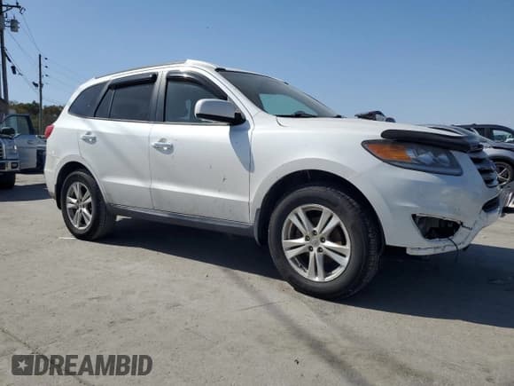 ✅ 2012 Hyundai Santa Fe Limited • VIN: 5XYZK4AG0CG144702 • Lot: 75204044. Listed on Copart with 173,296 mi. Free auction sales archive from the USA and detailed vehicle history report at DreamBid. Image 4.