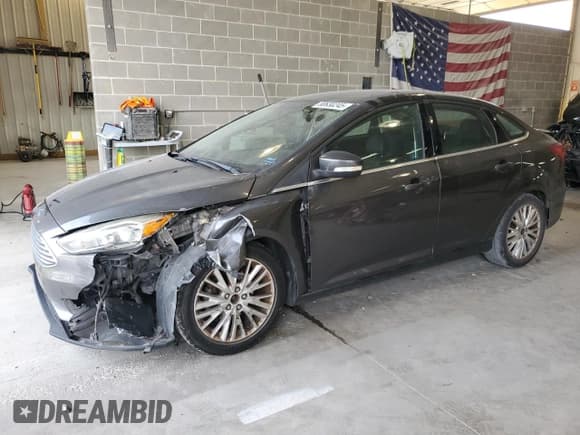 ✅ 2015 Ford Focus Titanium • VIN: 1FADP3J20FL231220 • Lot: 80630245. Listed on Copart with 143,805 mi. Free auction sales archive from the USA and detailed vehicle history report at DreamBid. Image 1.