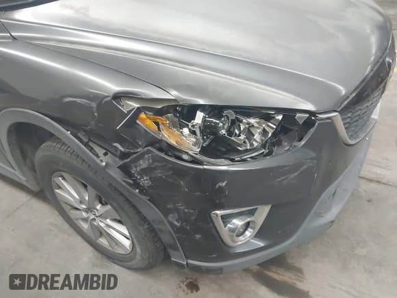 ✅ 2014 Mazda CX-5 Touring • VIN: JM3KE4CY0E0430130 • Lot: 43830898. Wystawiony na IAAI z przebiegiem 169 053 mil. Bezpłatny archiwum sprzedaży aukcyjnych z USA i szczegółowy raport historii pojazdu na DreamBid. Zdjęcie 6.