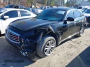 ✅ 2016 Infiniti QX70 • VIN: JN8CS1MW9GM752735 • Lot: 41271197. Listed on IAAI with 165,269 mi. Free auction sales archive from the USA and detailed vehicle history report at DreamBid. Image 14.