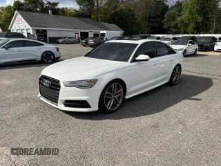 ✅ 2018 Audi S6 Premium Plus • VIN: WAUFFAFC9JN039803 • Лот: 74598804. Опубликован ранее на Copart с пробегом 77 940 миль. Бесплатный доступ к архиву аукционных продаж из США и подробный отчёт об истории автомобиля на DreamBid. Изображение 2.