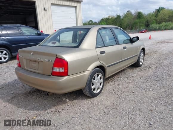 ✅ 2003 Mazda Protege DX • VIN: JM1BJ225430210759 • Lot: 41957515. Listed on IAAI with 186,705 mi. Free auction sales archive from the USA and detailed vehicle history report at DreamBid. Image 4.