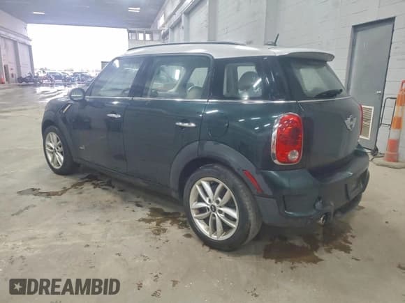 ✅ 2013 MINI Countryman S ALL4 • VIN: WMWZC5C57DWP32208 • Lot: 95294255. Listed on Copart with 124,849 mi. Free auction sales archive from the USA and detailed vehicle history report at DreamBid. Image 2.