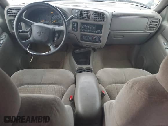 1999 Chevrolet Blazer LS z VIN 1GNDT13W7X2210017, wystawiony jako Copart lot #80454764 z przebiegiem 120 465 mil mil oraz Szkoda całkowita • Salvage title. Historia ofert i sprzedaży dostępna na DreamBid. Obrazek 8.