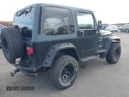 ✅ 2000 Jeep Wrangler Sport • VIN: 1J4FA49S8YP783696 • Lot: 43559467. Listed on IAAI with 132,396 mi. Free auction sales archive from the USA and detailed vehicle history report at DreamBid. Image 4.