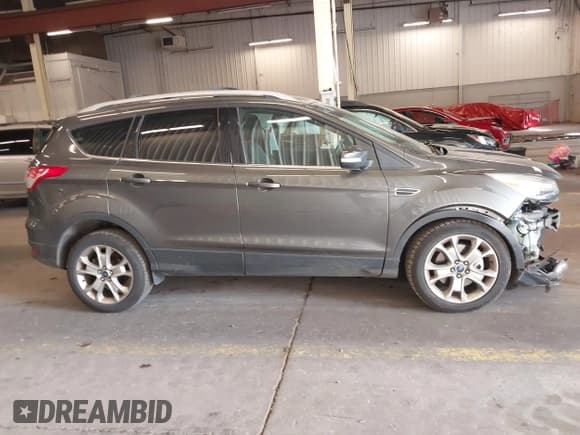 ✅ 2015 Ford Escape Titanium • VIN: 1FMCU9J98FUC05727 • Lot: 42229328. Listed on IAAI with 112,896 mi. Free auction sales archive from the USA and detailed vehicle history report at DreamBid. Image 14.