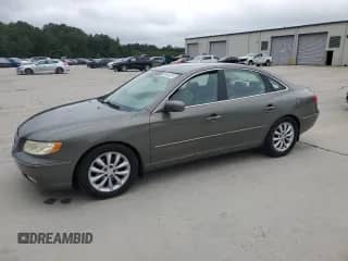 2006 Hyundai Azera SE z VIN KMHFC46FX6A135022, wystawiony jako Copart lot #69843315 z przebiegiem 218 656 mil mil oraz Szkoda całkowita • Salvage title. Historia ofert i sprzedaży dostępna na DreamBid. Obrazek 1.