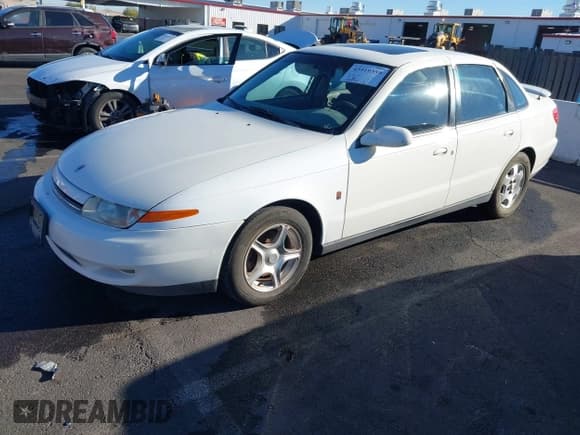✅ 2001 Saturn LS • VIN: 1G8JW54R31Y536527 • Lot: 43919359. Listed on IAAI with 99,541 mi. Free auction sales archive from the USA and detailed vehicle history report at DreamBid. Image 2.