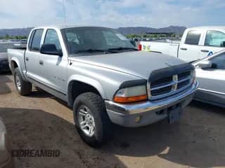 2002 Dodge Dakota SLT с VIN 1B7HG48NX2S557995, выставлен на аукционе IAAI как лот 42791890 с пробегом 193 050 миль миль и . История ставок и продаж доступна на DreamBid. Изображение 1.