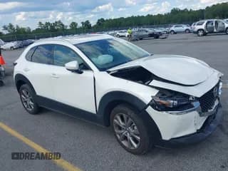 ✅ 2023 Mazda CX-30 S Premium • VIN: 3MVDMBDMXPM560144 • Лот: 42838301. Опубликован ранее на IAAI с пробегом 19 256 миль. Бесплатный доступ к архиву аукционных продаж из США и подробный отчёт об истории автомобиля на DreamBid. Изображение 1.