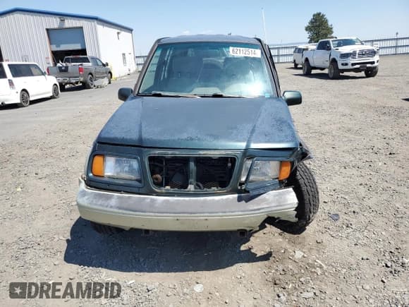 ✅ 1998 Suzuki Sidekick • VIN: JS3TD21V9W4103914 • Lot: 62112514. Listed on Copart with 394,872 mi. Free auction sales archive from the USA and detailed vehicle history report at DreamBid. Image 5.