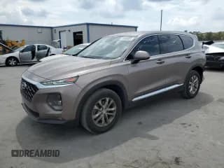 ✅ 2019 Hyundai Santa Fe SEL • VIN: 5NMS33AD0KH005205 • Лот: 46968003. Опубликован ранее на Copart с пробегом 62 270 миль. Бесплатный доступ к архиву аукционных продаж из США и подробный отчёт об истории автомобиля на DreamBid. Изображение 1.