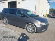 ✅ 2012 Honda Odyssey Touring • VIN: 5FNRL5H96CB088475 • Lot: 43510401. Listed on IAAI with 156,935 mi. Free auction sales archive from the USA and detailed vehicle history report at DreamBid. Image 1.