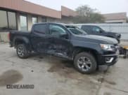 ✅ 2019 Chevrolet Colorado 4WD Z71 • VIN: 1GCGTDEN5K1329341 • Лот: 71913234. Опубликован ранее на Copart с пробегом 56 159 миль. Бесплатный доступ к архиву аукционных продаж из США и подробный отчёт об истории автомобиля на DreamBid. Изображение 4.