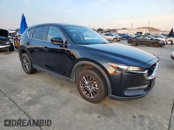 ✅ 2021 Mazda CX-5 Touring • VIN: JM3KFACMXM0462090 • Лот: 70245705. Опубликован ранее на Copart с пробегом 96 650 миль. Бесплатный доступ к архиву аукционных продаж из США и подробный отчёт об истории автомобиля на DreamBid. Изображение 4.