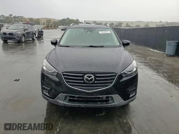 ✅ 2016 Mazda CX-5 Grand Touring • VIN: JM3KE2DY6G0700984 • Lot: 95326875. Listed on Copart with 244,245 mi. Free auction sales archive from the USA and detailed vehicle history report at DreamBid. Image 14.
