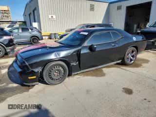 2014 Dodge Challenger SXT с VIN 2C3CDYAG5EH100467, выставлен на аукционе Copart как лот 85343015 с пробегом 169 078 миль миль и Списание • Salvage title. История ставок и продаж доступна на DreamBid. Изображение 1.