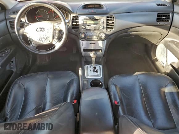 ✅ 2007 Kia Optima LX • VIN: KNAGE124875152821 • Лот: 94361915. Опубликован ранее на Copart с пробегом 199 646 миль. Бесплатный доступ к архиву аукционных продаж из США и подробный отчёт об истории автомобиля на DreamBid. Изображение 8.