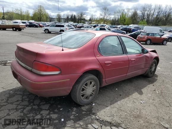 ✅ 1998 Chrysler Cirrus LXi • VIN: 1C3EJ56H7WN307792 • Lot: 52449025. Listed on Copart with 179,548 mi. Free auction sales archive from the USA and detailed vehicle history report at DreamBid. Image 3.