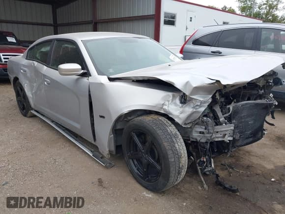 ✅ 2012 Dodge Charger Police • VIN: 2C3CDXAT1CH305496 • Lot: 43428332. Listed on IAAI with 249,533 mi. Free auction sales archive from the USA and detailed vehicle history report at DreamBid. Image 1.