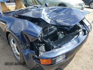 ✅ 1994 Porsche 911 • VIN: WP0AB2964RS420363 • Lot: 42097800. Wystawiony na IAAI z przebiegiem 99 635 mil. Bezpłatny archiwum sprzedaży aukcyjnych z USA i szczegółowy raport historii pojazdu na DreamBid. Zdjęcie 6.