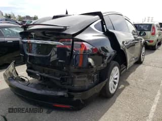 ✅ 2018 Tesla Model X 75D • VIN: 5YJXCDE26JF091396 • Lot: 39715673. Listed on Copart with 23,972 mi. Free auction sales archive from the USA and detailed vehicle history report at DreamBid. Image 3.