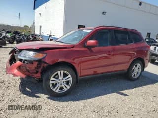 ✅ 2012 Hyundai Santa Fe SE • VIN: 5XYZHDAG1CG138065 • Lot: 70289844. Listed on Copart with 144,549 mi. Free auction sales archive from the USA and detailed vehicle history report at DreamBid. Image 1.