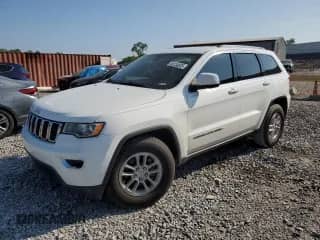 2018 Jeep Grand Cherokee Laredo E with VIN 1C4RJEAG3JC340000, listed as a Copart auction lot 58134555 with 202,491 mi miles and Salvage title. Bid and sale history available at DreamBid. Image 1.