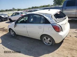 ✅ 2011 Kia Rio LX • VIN: KNADH5A39B6755340 • Lot: 74141444. Listed on Copart with 144,195 mi. Free auction sales archive from the USA and detailed vehicle history report at DreamBid. Image 2.
