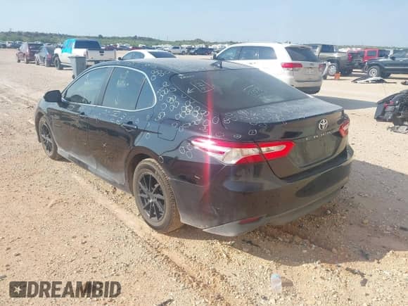 2019 Toyota Camry LE z VIN 4T1B11HK9KU725556, wystawiony jako IAAI lot #42922588 z przebiegiem 138 969 mil mil oraz . Historia ofert i sprzedaży dostępna na DreamBid. Obrazek 3.