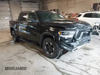 2019 Ram 1500 Rebel z VIN 1C6SRFLT2KN740072, wystawiony jako IAAI lot #43130521 z przebiegiem 94 106 mil mil oraz . Historia ofert i sprzedaży dostępna na DreamBid. Obrazek 1.